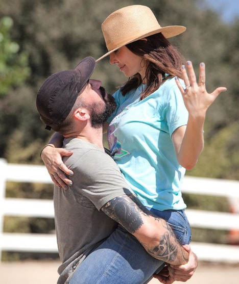 Whitney and her fiance Miles taking a picture together.